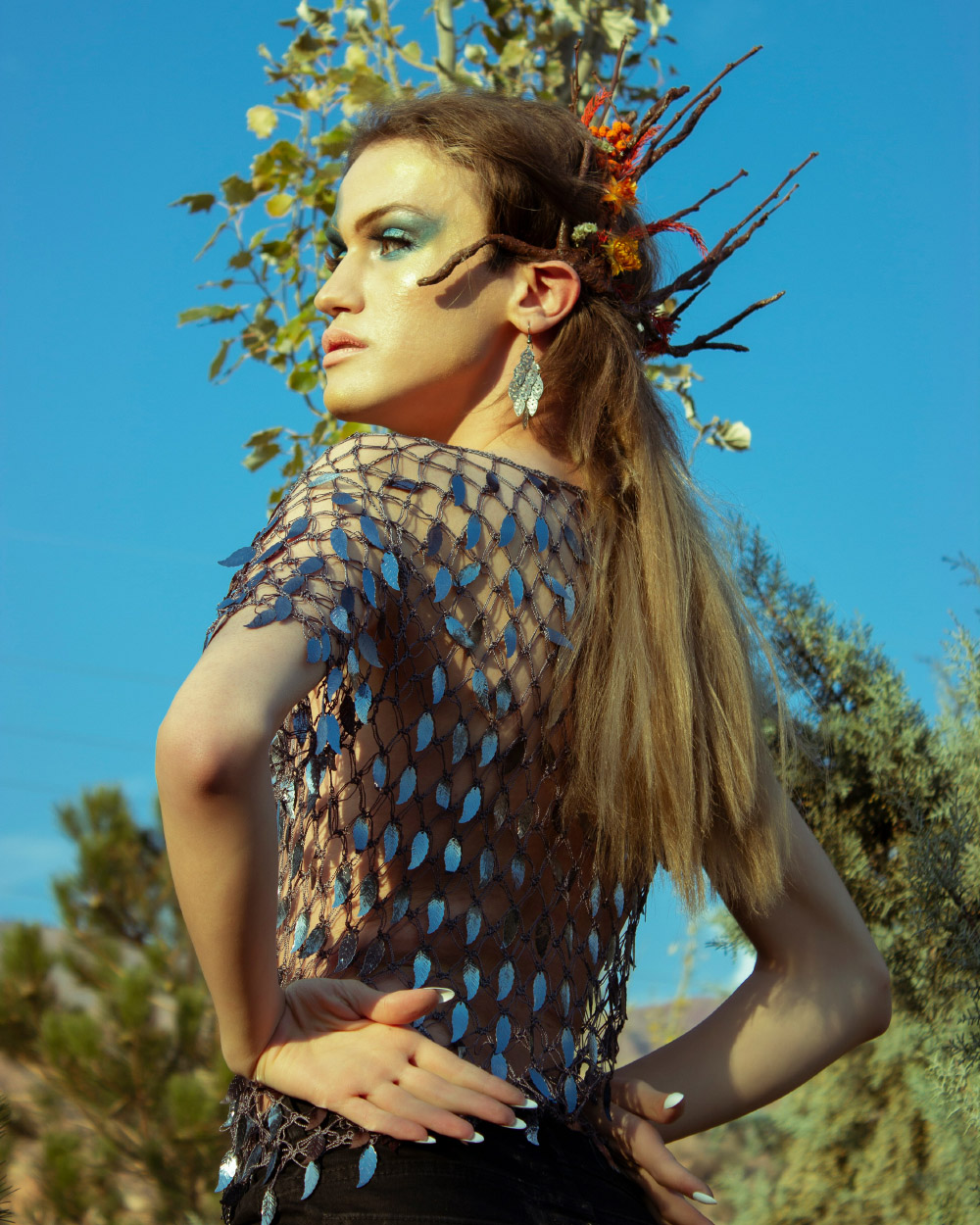 Person with long hair and artistic makeup, representing self-expression and personal confidence.